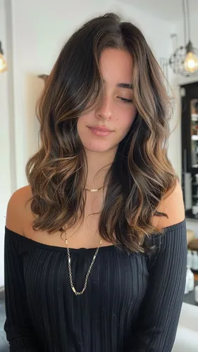 Medium curly hairstyle enhancing natural bounce and volume for females