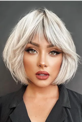 Try on a messy, blonde bob haircut with lighter ends, styled in a tousled manner that gives a relaxed yet fashionable look.
