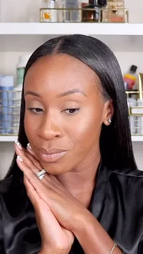 Try on this sleek, straight, long hairstyle visible on a woman, with her hair neatly parted in the center. Her hairstyle flows smoothly down past her shoulders.