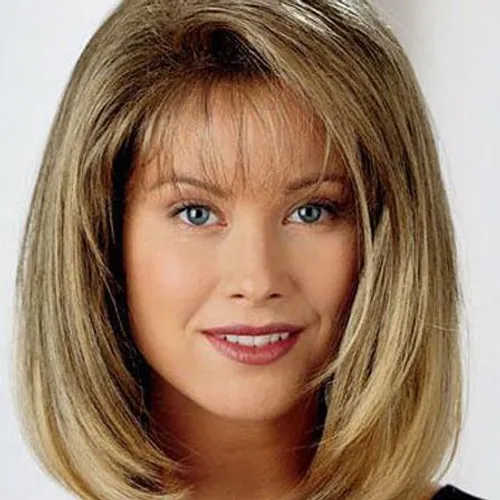 Try on this elegant medium length, layered hairstyle featuring smooth straight layers that gently frame the face.