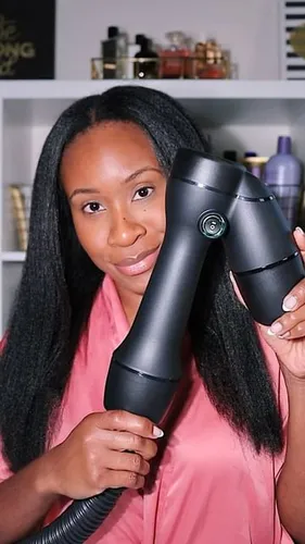 try on straight hair, the woman holds a hair dryer near her face, showcasing her long, straight hairstyle.