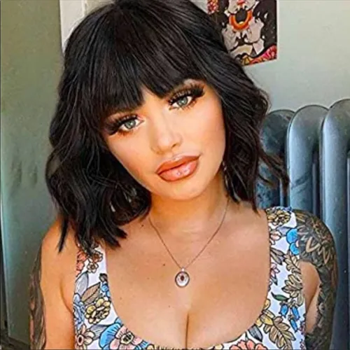 Try on this short wavy hairstyle that flows smoothly with subtle curls at the ends, adding a playful and sophisticated look.