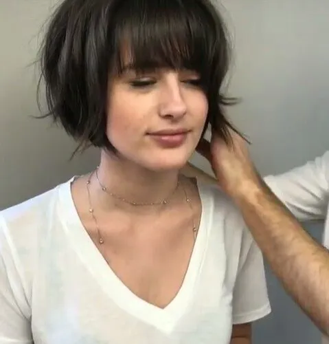 Try on a bob cut hairstyle, featuring even and straight hair trimmed around jaw level.