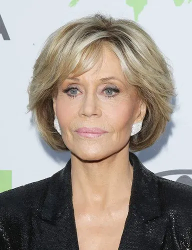 Try on this elegantly styled layered bob haircut, featuring soft, face-framing layers that add volume and texture to the hair.