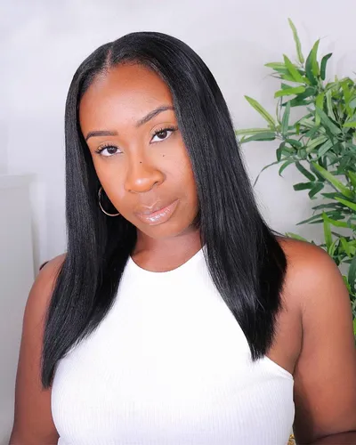 Try on this sleek, long straight hairstyle that gently tapers toward the ends