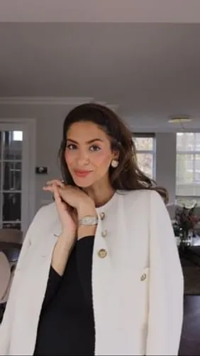 Try on a sleek and neatly styled long hairstyle, as shown by the woman facing forward with a gentle smile.
