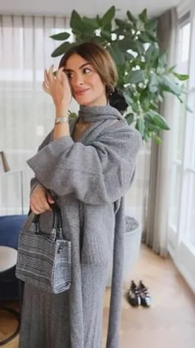 Try on a medium length hairstyle, visible in a home setting with a casual outfit.