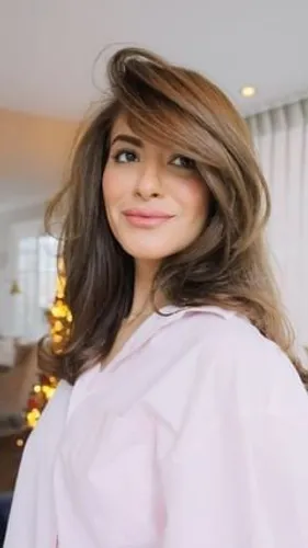 Try on this beautiful long wavy hairstyle that elegantly frames the face, adding a soft, voluminous look perfect for any occasion.