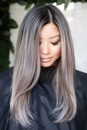 Try on this hairstyle featuring straight hair with a smooth ombre color transition from darker roots to lighter ends.