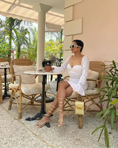 Try on this sleek updo hairstyle, styled neatly away from the face and gathered at the back, creating an elegant and clean look.