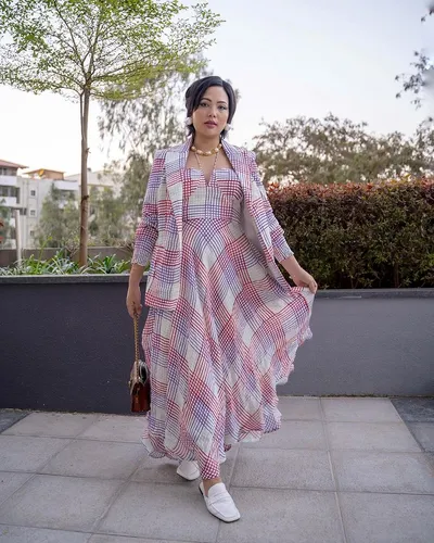 Try on this medium-length hairstyle with partial view obscured, adding an airy, relaxed vibe to the overall appearance, suggesting both ease and style.