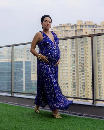 Try on a sleek bun hairstyle, with neatly combed and tightly pulled back hair, fastened at the nape in a tidy bun, presenting a polished and elegant appearance.