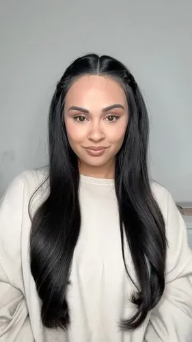 Try on this long black hairstyle with a face-framing layer and a hint of wave for volume.