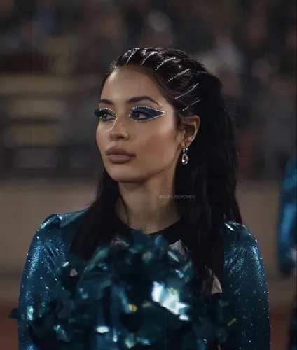 Try on this elegant braided and glossy hairstyle, featured braids intricately woven into sleek, dark locks.