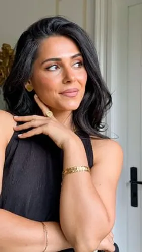 try on this wavy, black hairstyle, falling gracefully just past the shoulders.