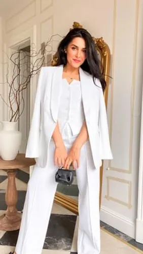 Try on this elegant long wavy hairstyle, where the waves add a touch of sophistication to the overall look.