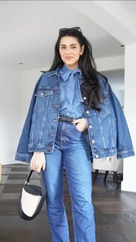 Try on this long hairstyle featuring sleek, dark hair cascading over the shoulders.