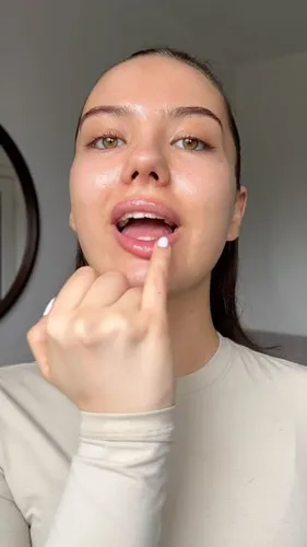 Try on this slicked back hairstyle where the hair is smoothly pulled back from the face, appearing neat and tidy.