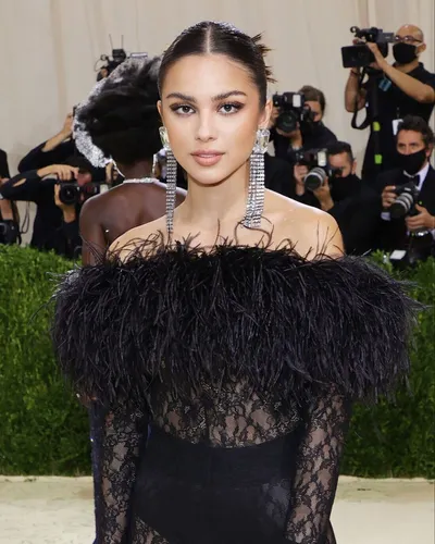 Try on this sleek center-parted ponytail for an elegant look.