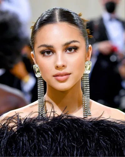 Try on this sleek, center-parted, slicked back hairstyle that radiates elegance and sophistication.