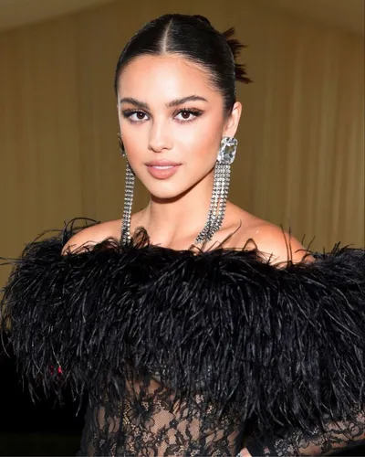 Try on a sleek bun hairstyle, intricately styled for a polished look with a smooth crown and neatly secured at the back.