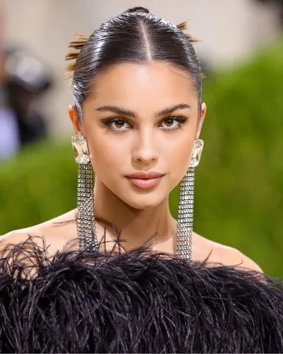 Try on a slicked-back hairstyle with short ends protruding at the back.