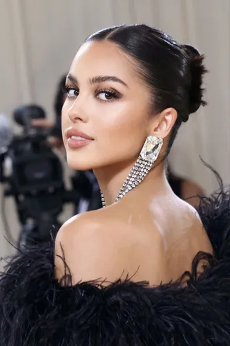Try on this slicked back bun style, perfect for an elegant look.