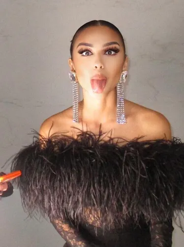 Try on this slicked back hairstyle featuring a smooth and sleek appearance, ideal for a polished look.