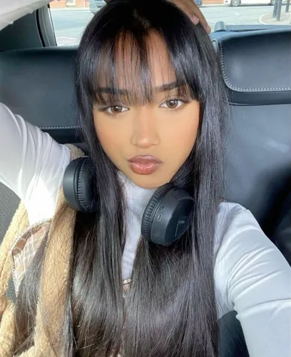 Try on a sleek and long straight hairstyle, with hair falling evenly down past the shoulders.