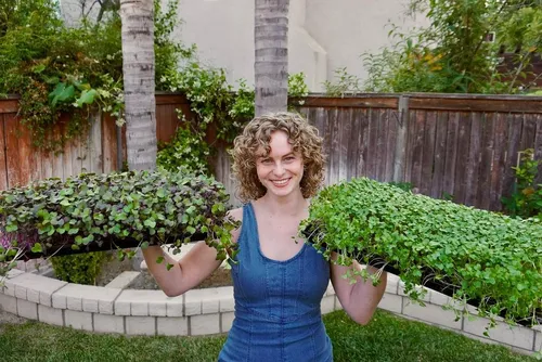 Try on a cheerful short curly hairstyle, well-suited for a vibrant and youthful appearance.