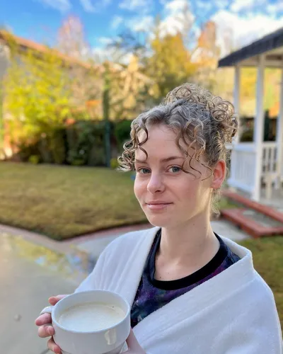 Try on curly hairstyle, featuring tight curls.