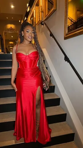 Try on this hairstyle featuring long braids extended with golden highlights, sweeping over the shoulder gracefully.