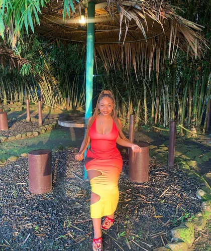 Try on the long hair styled look that is seen on the person in the image.