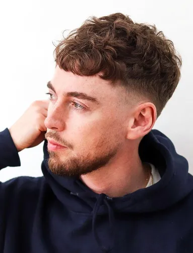 Try on a short, curly hairstyle with textured layers.