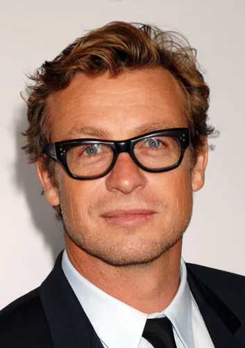 Try on this tousled, medium-length wavy hairstyle paired with glasses for a smart look.