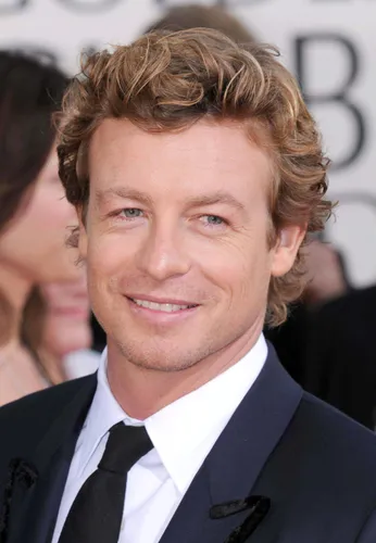 Try on this textured medium-length curly hairstyle that could enhance a charming gentleman's look, providing a sophisticate yet relaxed style.