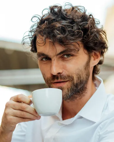 Try on this medium-length, curly hairstyle