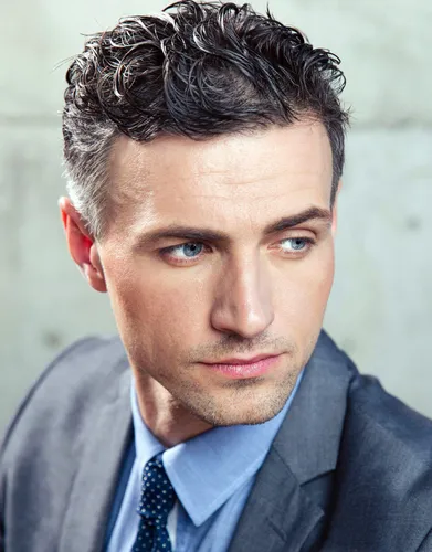 Try on this stylish short curly hairstyle, neatly styled with defined curls adding both texture and volume.