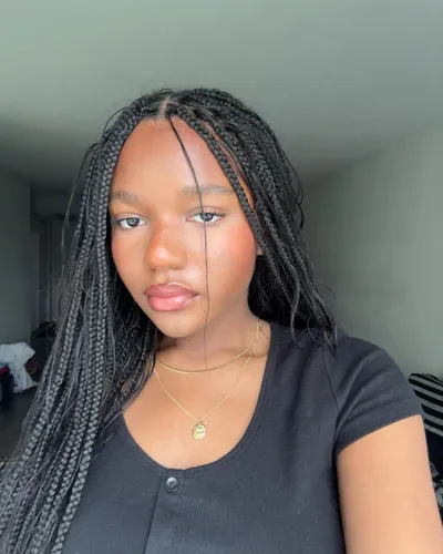 try on a hairstyle featuring long, neatly braided hair