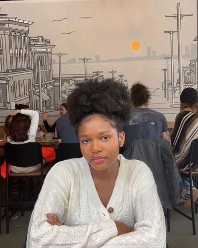 try on a bold curly afro hairstyle