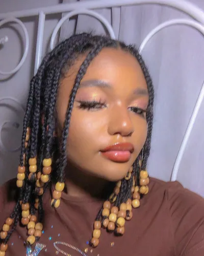 Try on this braided hairstyle enhanced with delicate beading