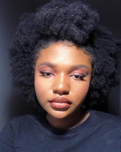 try on a voluminous afro hairstyle