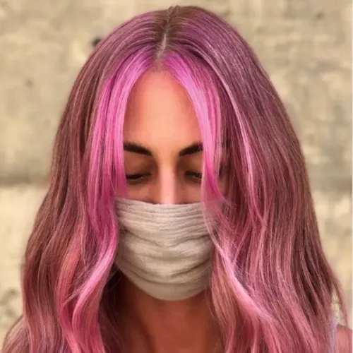 Try on a medium length hairstyle featuring a vibrant blend of pink shades.