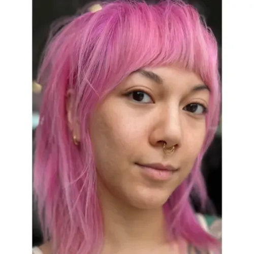 Try on this vibrant pink straight hairstyle, featuring smooth, light pink strands that frame the face with a youthful and edgy look.