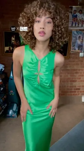 Try on this voluminous curly hairstyle, featuring abundant curls that add a touch of elegance and dynamic texture.