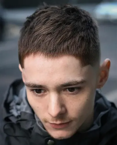 try on this short, neatly trimmed crew cut hairstyle. The hair is closely cropped around the sides and back with slightly longer coverage on top.
