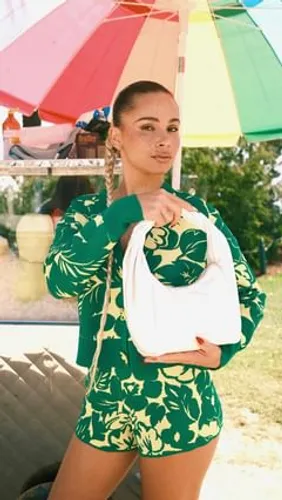 Try on a slicked back hairstyle, featuring a neat and sleek appearance, tightly pulled back away from the face.