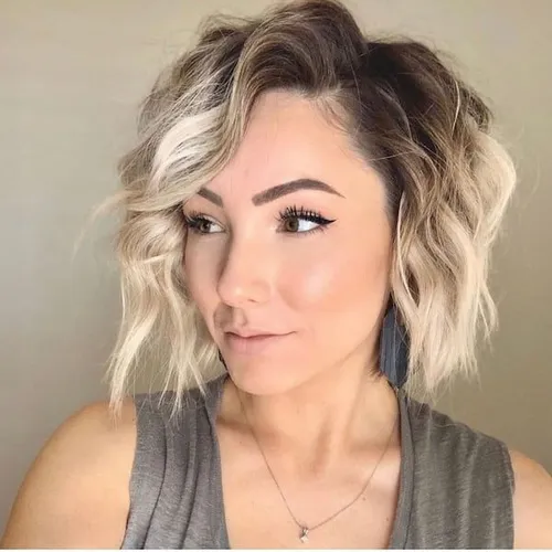 Try on this trendy wavy, blonde bob hairstyle