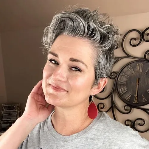 Try on this stylish short, curly gray hairstyle featured in the image.