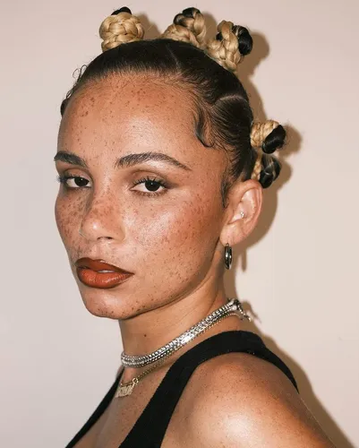 try on a creative and stylish hairstyle featuring multiple bantu knots arranged symmetrically across the scalp
